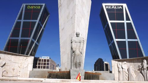 Low angle view of statue against blue sky