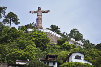 Low angle view of statue against sky