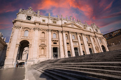 Low angle view of historical building against cloudy sky