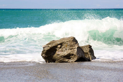 Scenic view of rocks on beach