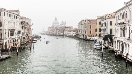 Grand canal amidst buildings against sky