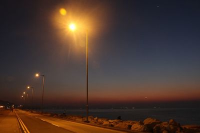 Sea against sky at night