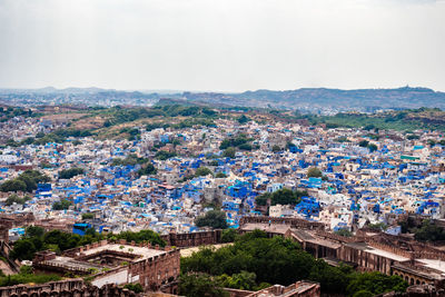 Blue city view from fort with flat bright sky at morning