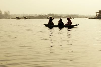 People on boat in sea