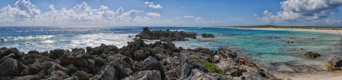 Scenic view of sea against cloudy sky