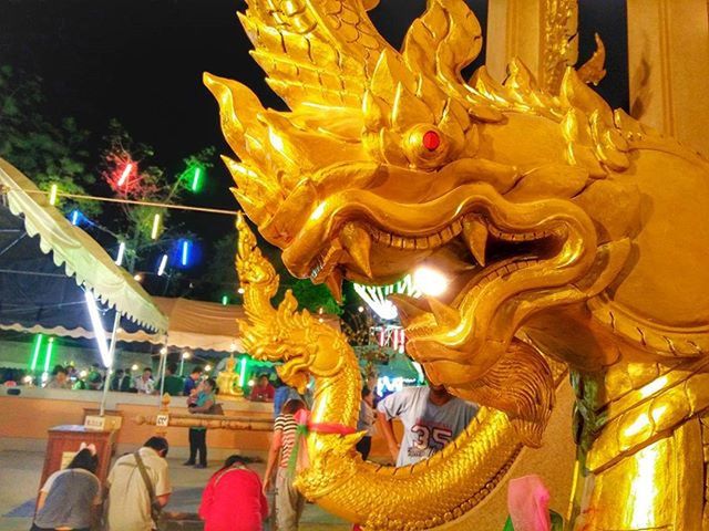 art and craft, illuminated, art, statue, sculpture, creativity, human representation, animal representation, indoors, arts culture and entertainment, night, gold colored, temple - building, religion, cultures, low angle view, decoration, ornate