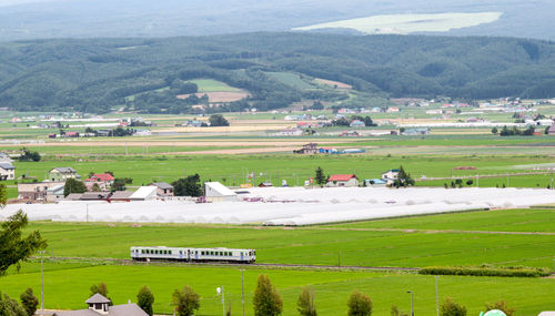 Scenic view of agricultural field against mountains