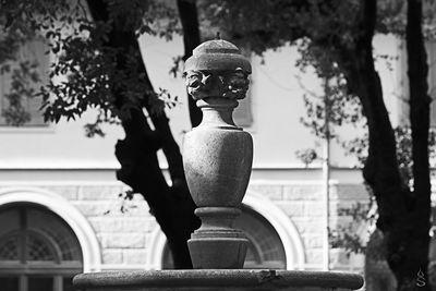 Close-up of statue against building