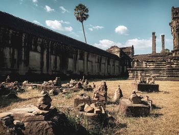 Old ruins of temple against cloudy sky