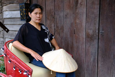 Portrait of mature woman sitting on rickshaw