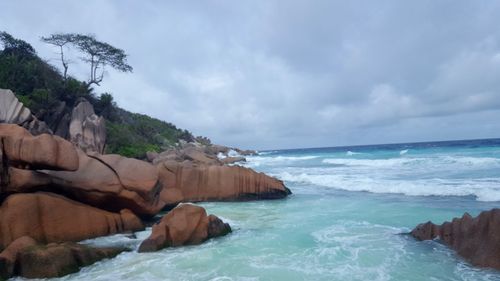 View of calm sea against cloudy sky