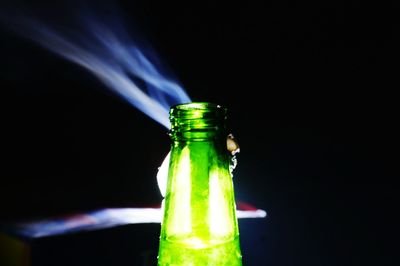 Close-up of bottle against black background