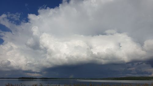 Scenic view of storm clouds over landscape