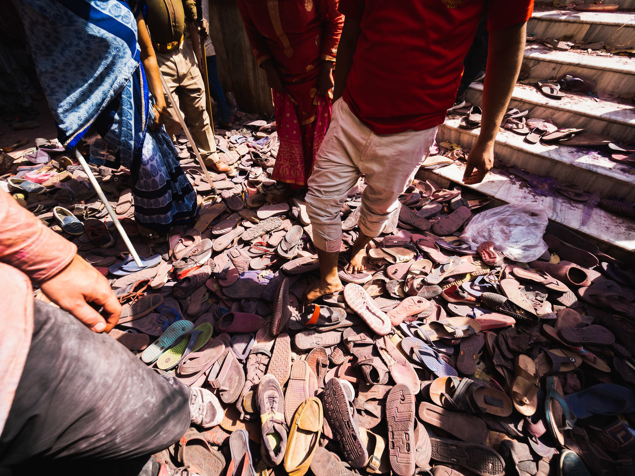 real people, low section, group of people, human body part, human leg, standing, men, people, body part, high angle view, day, lifestyles, shoe, messy, nature, outdoors, working, group