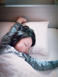 Woman lying on bed