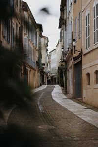 Narrow alley along buildings