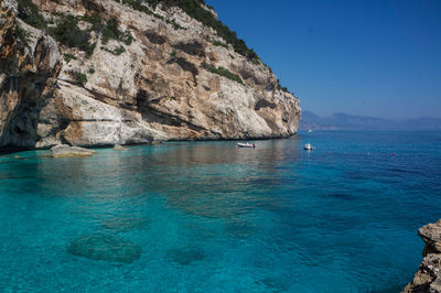 Scenic view of sea against clear blue sky