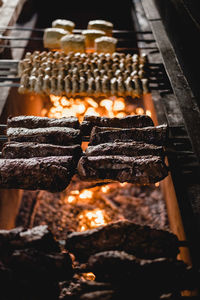 Close-up of burning candles on barbecue grill