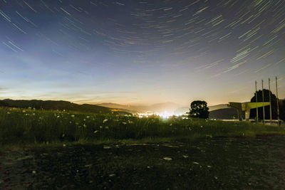 Scenic view of field against sky at night