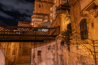 Low angle view of illuminated building at night