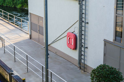 High angle view of life belt mounted on pier