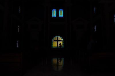 Illuminated window in dark room