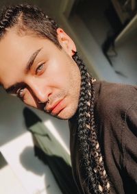 Close-up portrait of young man looking away