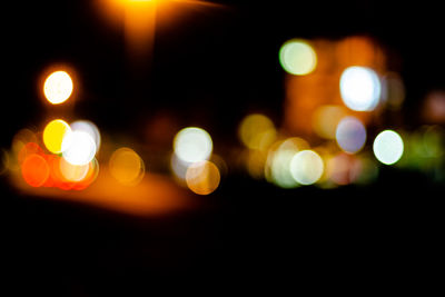 Defocused image of illuminated lights at night