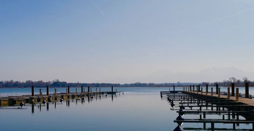 Pier on lake against sky