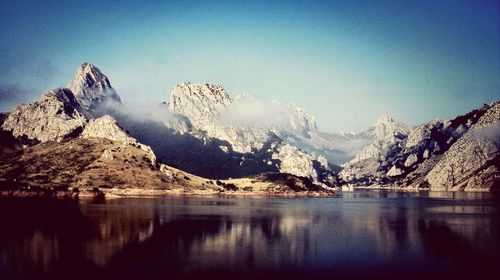 Scenic view of lake with mountains in background