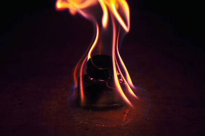 Close-up of flame on table