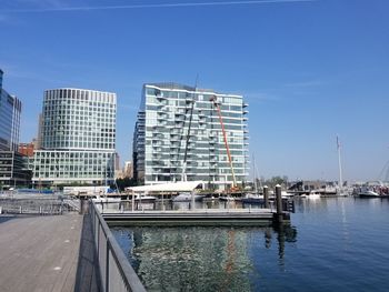 View of city buildings against clear sky