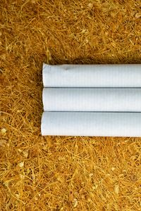 High angle view of hay bales on grass