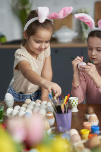 Girl preparing eater eggs at home