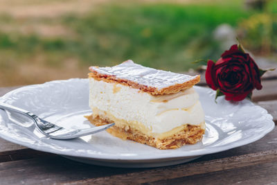 Close-up of mille-feuille in plate on table outdoors