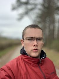 Portrait of young man standing outdoors