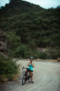 Man riding bicycle on road