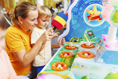 Portrait of smiling girl eating food at home