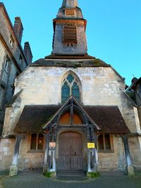 Low angle view of old building against clear sky