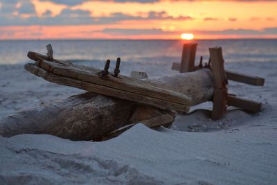 Close-up of sea against sky during sunset