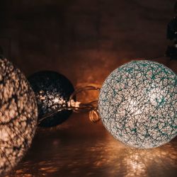 Close-up of illuminated lighting equipment on table