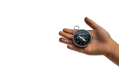 Midsection of person holding clock against white background