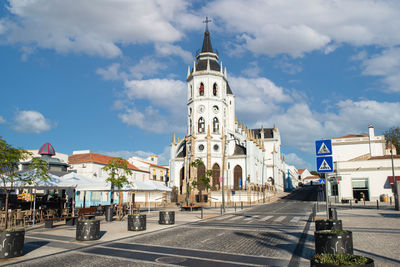 Buildings in city against sky