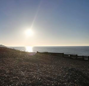 Scenic view of sea against clear sky during sunset