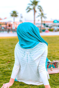 Rear view of woman on field