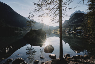 Scenic view of lake and mountains against sky