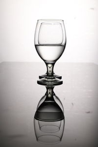 Close-up of eyeglasses against wall