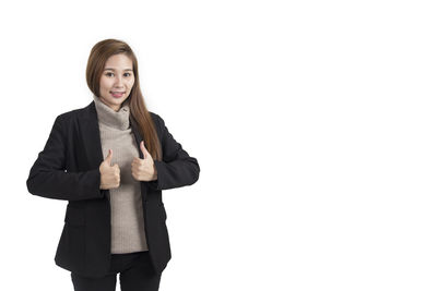Portrait of young woman against white background