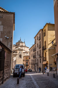 View of buildings in city against clear sky