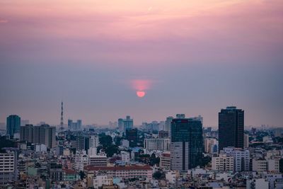 Cityscape against sky during sunset